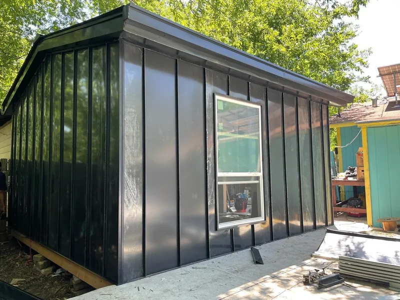 Black standing seam metal wall panels for Roof Inspection in Wake Forest