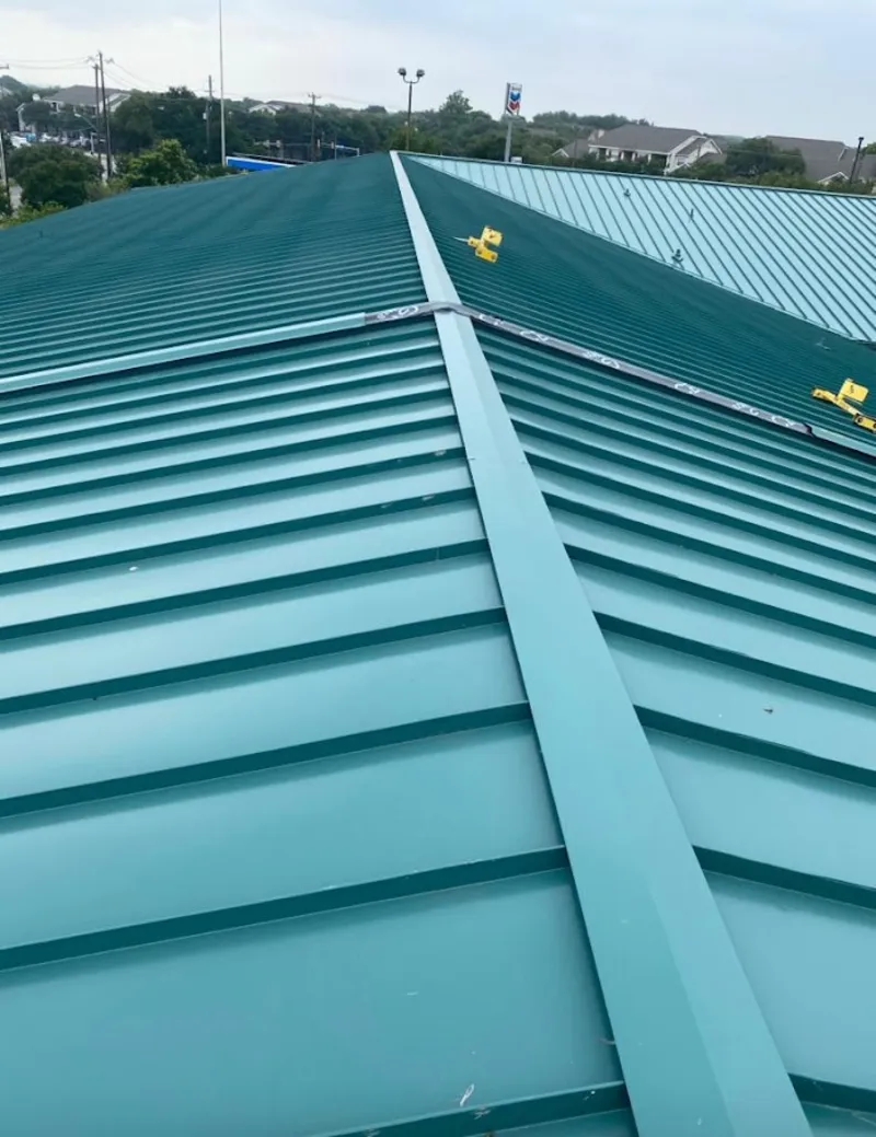 Green commercial metal roof ridge and valley for Metal Roof Repair in Wake Forest