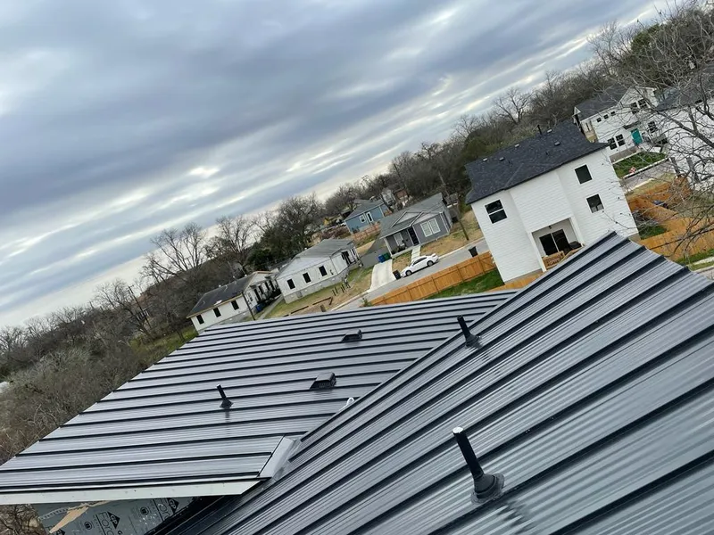 Standing seam metal roof panels with vents for Skylight Repair in Wake Forest
